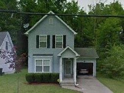 Warren house for rent - A house with a grey front and a garage.