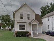 Warren house for rent - A house with a white front porch and a brown roof.