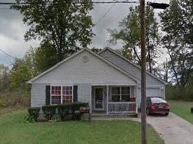 Warren house for rent - A small house with a porch and a car parked in front.