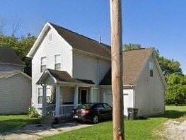 Warren house for rent - A white house with a black car parked in front.