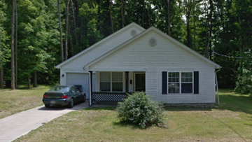 Warren house for rent - A small white house with a car parked in front.