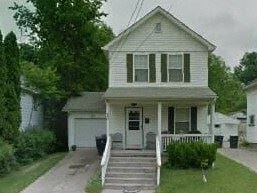 Warren house for rent - A white house with a grey roof and a black trash bin.