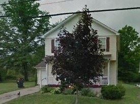 Warren house for rent - A white house with a tree in front of it.