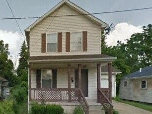Warren house for rent - A small house with a porch and a brown door.