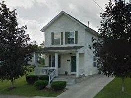 Warren house for rent - A white house with a green door and a porch.