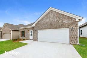 Cullman house for rent - A brick house with a white garage door in front.