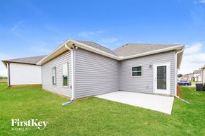 Cullman house for rent - A single-story house with a grey exterior and a white door.