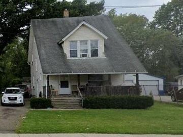 Warren house for rent - A white house with a grey roof and a car parked in front.