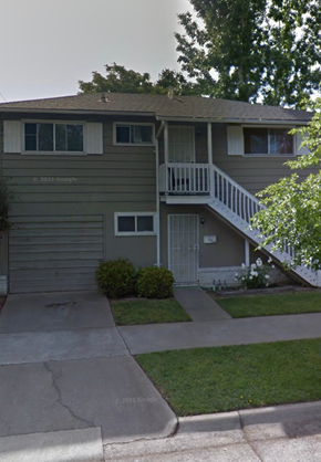 Sacramento apartment for rent - A two-story house with a garage and a balcony.