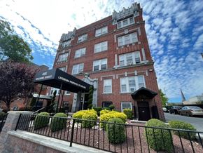 East Orange apartment for rent - A tall red brick building with a black awning that reads "William Street Lafayette".