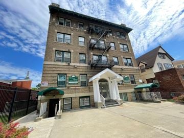East Orange apartment for rent - A building with a green awning and a sign that says "NO PARKING".