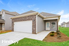 Cullman house for rent - A house with a garage door and a driveway.