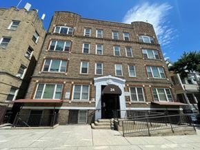 East Orange apartment for rent - A brown building with the number 24 on the front.