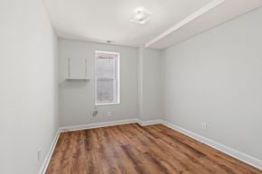 Philadelphia apartment for rent - A room with wooden floors and a window.
