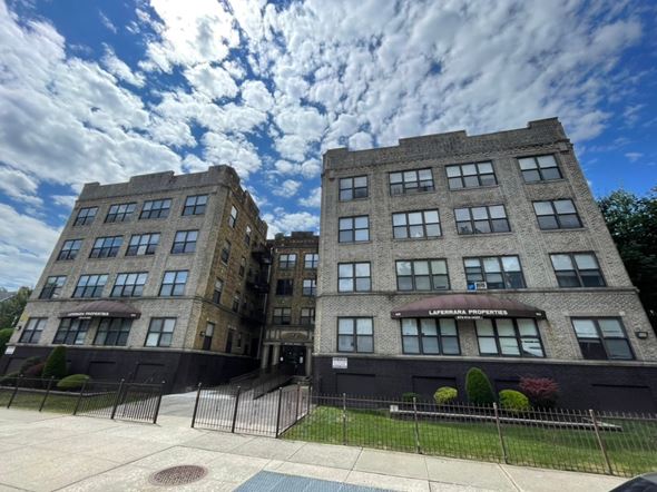 East Orange apartment for rent - A large building with the words "Lafayette Properties" on the front.