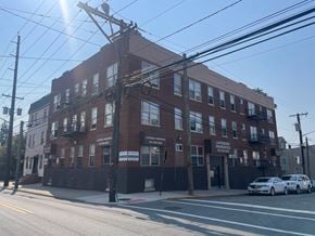 Irvington apartment for rent - A large brick building with a sign that says "Leisure Products" on it.