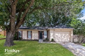 Garland house for rent - A house with a tree in front of it.