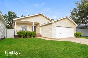 Tomball house for rent - A house with a garage and a driveway is for sale.
