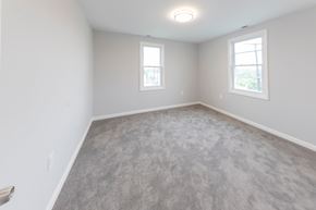 Rosedale apartment for rent - A room with grey carpet and two windows.