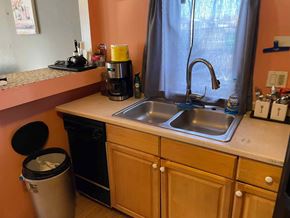 Chester apartment for rent - A kitchen with a sink, a coffee maker, and a window.