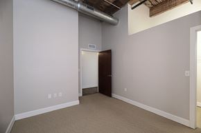 Kansas City apartment for rent - an empty living room with a door to a closet