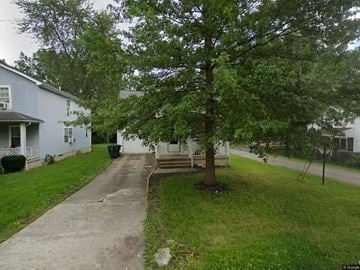 Warren house for rent - A tree in a front yard with a house in the background.