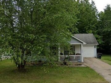 Warren house for rent - A small white house with a grey roof and a white picket fence.