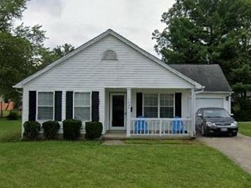 Warren house for rent - A small white house with a black car parked in front.