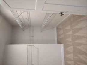 Laurel house for rent - a view of the ceiling of a bathroom with a ladder on the wall