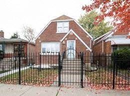Chicago house for rent - a house with a wrought iron fence in front of it
