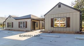 Durant apartment for rent - A house with a brown and beige exterior is shown.