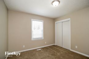 Canton house for rent - a bedroom with carpet and a door to a closet