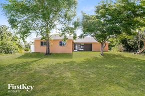 Lehigh Acres house for rent - a house with a yard and some trees