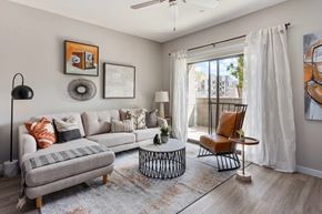 Avondale apartment for rent - a living room with a couch and a sliding glass door
