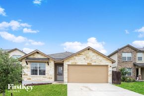 San Antonio house for rent - A house with a garage door is for sale by Firstkey Homes.
