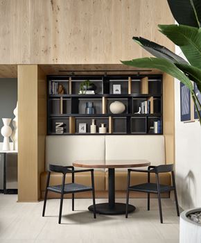 Lomita apartment for rent - Dining area at Kaia South Bay with table, chairs, and built-in bookshelf