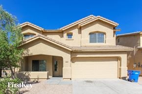 Laveen house for rent - a house with a driveway and a garage door