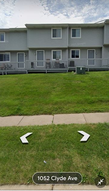 Cuyahoga Falls apartment for rent - a house with two arrows in the grass in front of it