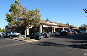 Culver City apartment for rent - a parking lot with cars parked in front of a store