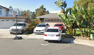 San Diego house for rent - a parking lot with cars parked in front of a house