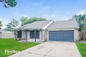 Houston house for rent - A house with a garage door is for sale by FirstKey Homes.