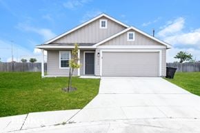 San Antonio house for rent - A house with a grey garage door and a small tree in front.