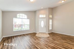 Davenport house for rent - the living room of a house with a hardwood floor and a white door