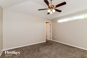 Davenport house for rent - the master bedroom has a ceiling fan and a carpeted floor