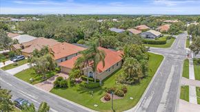 Sarasota house for rent - A residential area with houses and trees.