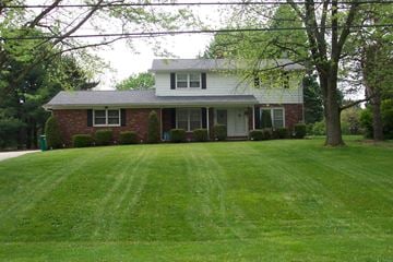 Hartville apartment for rent - a house with a large lawn in front of it