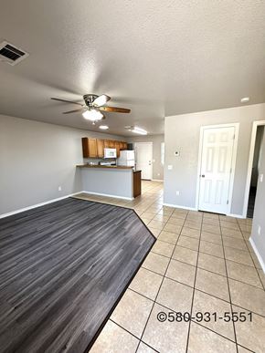 Durant apartment for rent - A room with a ceiling fan and a kitchenette.