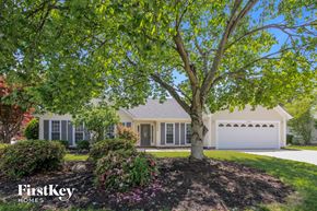 Charlotte house for rent - a home with a large tree in the front yard