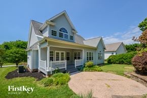High Point house for rent - A house with a blue and white exterior and a large front porch.