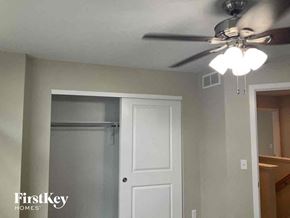Castle Rock house for rent - a bedroom with a ceiling fan and a closet
